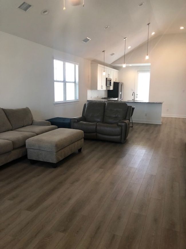 Living room with vaulted ceiling, healthy amount of natural light, and recessed lighting | Image 6
