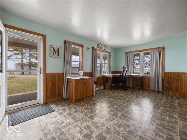 Many options for use in this room: sun/plant room, sitting room, a place to meet clients, another eating area. | Image 4