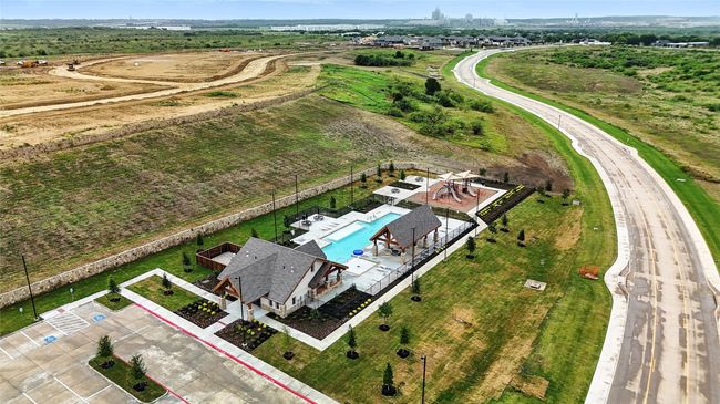 Aerial view of property and surrounding area with a pool and property parcel outlined | Image 36