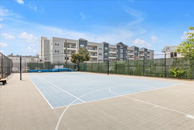 View of tennis court featuring community basketball court and fence | Image 24