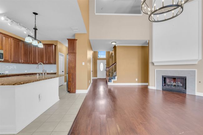 Kitchen featuring dark cabinets. | Image 10