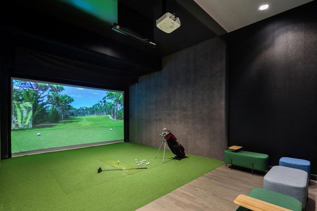 Recreation room featuring golf simulator and wood finished floors | Image 19