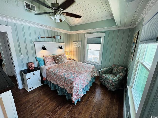 Bedroom with crown molding, lofted ceiling, dark hardwood / wood-style floors, and ceiling fan | Image 15