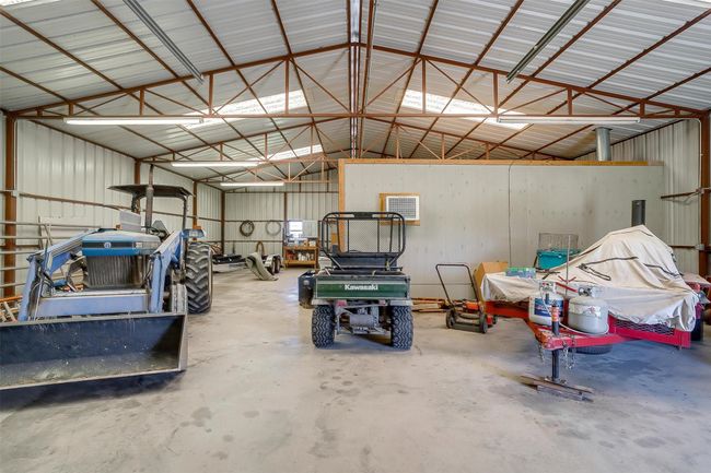 Garage featuring metal wall | Image 32