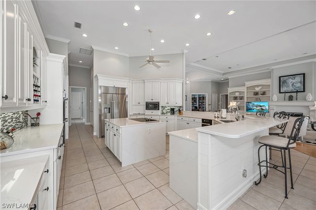 Dacor Refrigerator and ovens, induction cooking, desk area and extra long breakfast bar | Image 18
