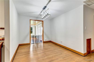 Unfurnished room with light wood-type flooring | Image 2