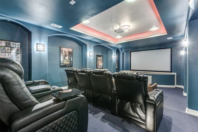 Enjoy a night at the movies in your own theater-style media room, with step-down seating. All media room lux chairs and all of the high-tech media equipment remain with the house! | Image 26
