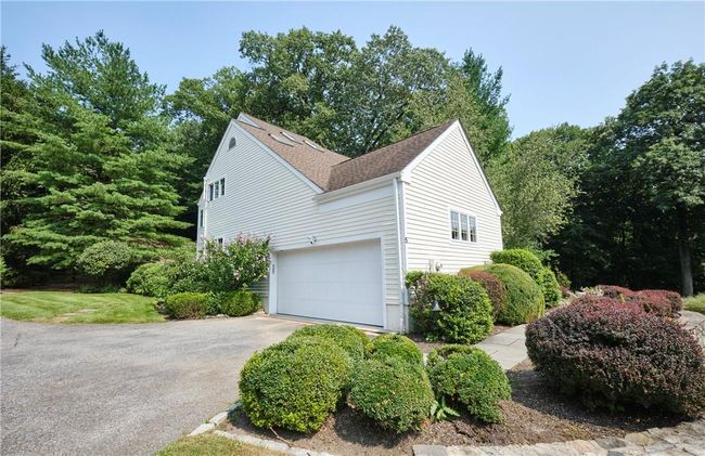 View of side of home with a garage | Image 6