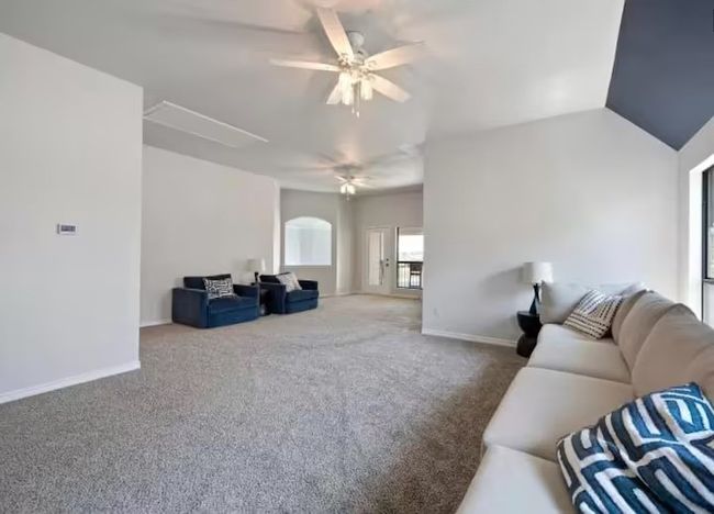 Living area with carpet floors and a ceiling fan | Image 9