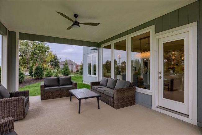 View of patio featuring an outdoor living space and ceiling fan | Image 48