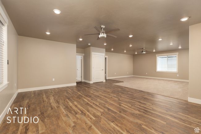 Spare room with ceiling fan, wood finished floors, and recessed lighting | Image 27