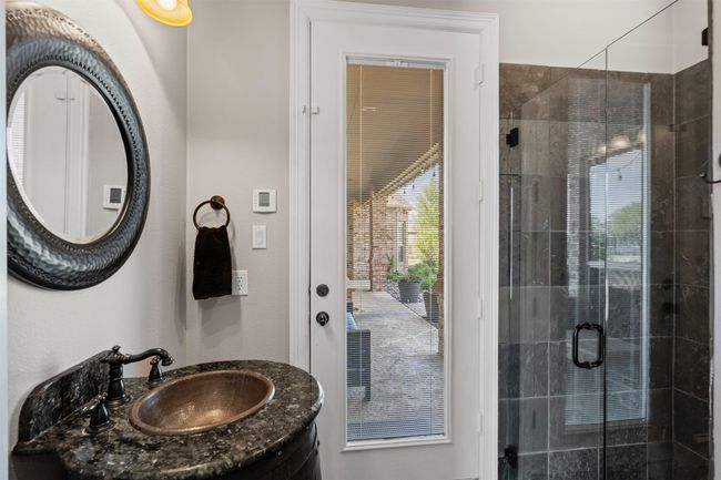 Bathroom featuring a shower stall and vanity | Image 23