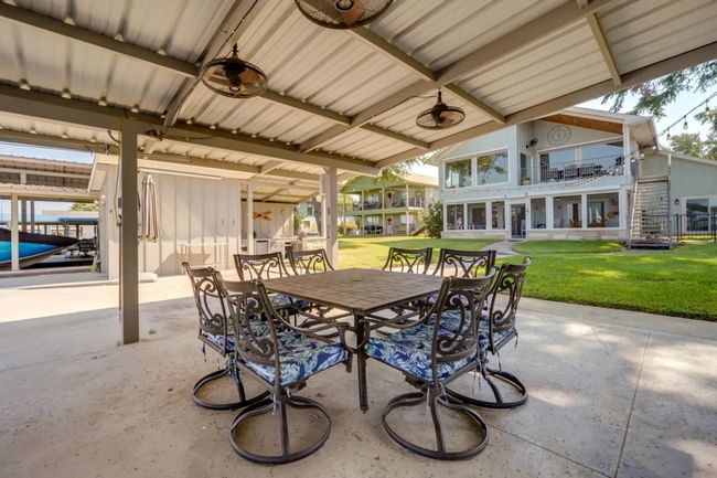 Patio / terrace featuring outdoor dining space, a patio area, and a yard | Image 31