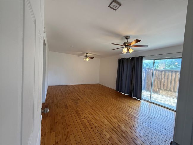 Empty room featuring ceiling fan and hardwood / wood-style flooring | Image 10