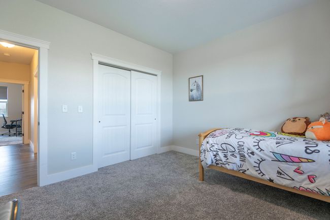 Carpeted bedroom featuring baseboards and a closet | Image 24