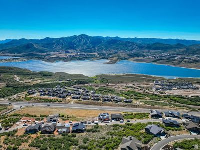 Drone / aerial view featuring a water and mountain view | Image 3