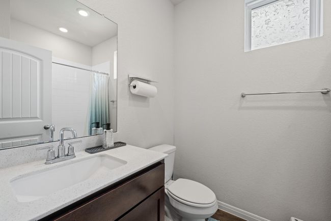 Full bathroom with toilet, vanity, a shower with shower curtain, and recessed lighting | Image 19