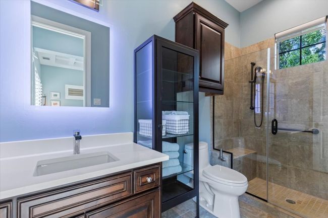 Full bath with a shower stall, toilet, and vanity | Image 28