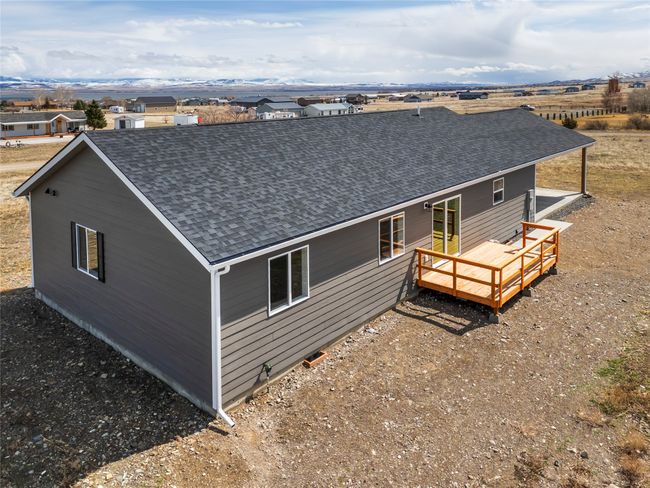Back of property with a wooden deck and roof with shingles | Image 13