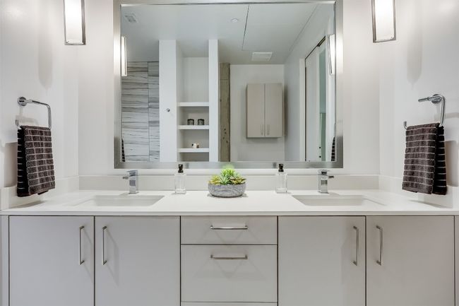 The ensuite bath feels like its own little escape, featuring a dual vanity that offers both space and convenience for getting ready in the morning | Image 22