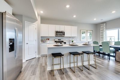 A beautiful kitchen with lots of space and a wonderful corner pantry. | Image 3