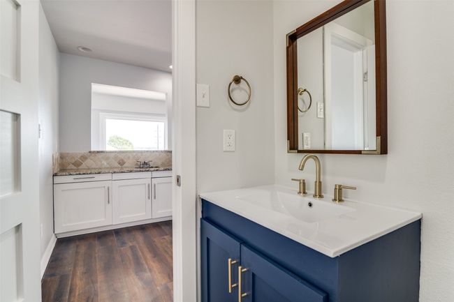 Half bath tucked away and conveniently located near the second living area. | Image 13