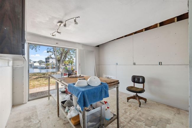 Kitchen area with sliders to back yard | Image 17