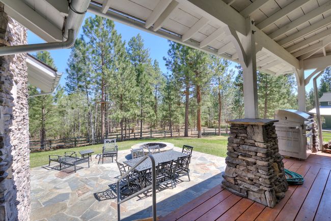 Main Home Back Deck and Firepit Access From Living Room/Dining Room Main Floor | Image 24