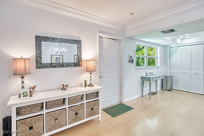 Doorway featuring ornamental molding and hardwood / wood-style flooring | Image 5