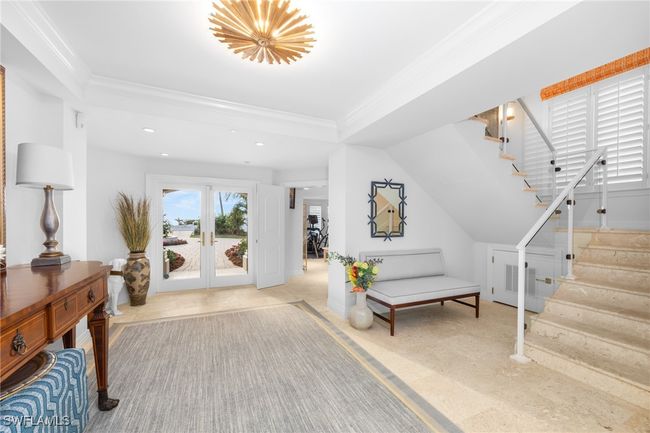 Entrance foyer featuring ornamental molding and french doors | Image 10