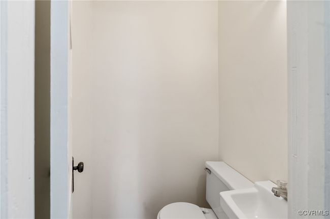 Bathroom featuring toilet and a sink | Image 22