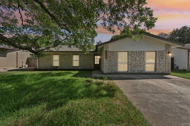 A quiet street, a charming exterior—this home makes a striking first impression. | Image 10