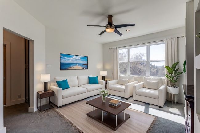 Living area featuring ceiling fan | Image 20