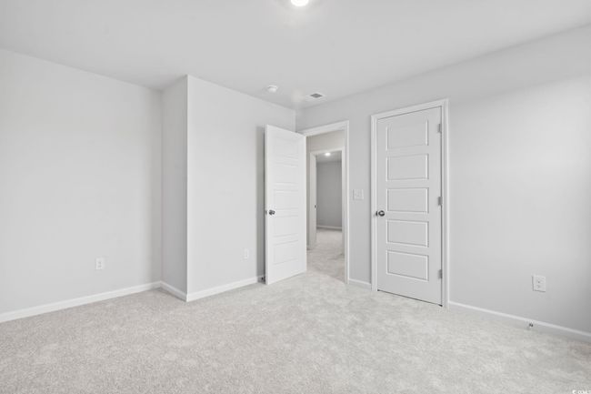 Unfurnished bedroom with carpet and baseboards | Image 8