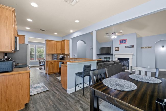 Kitchen with a breakfast bar, and arched walkways | Image 13