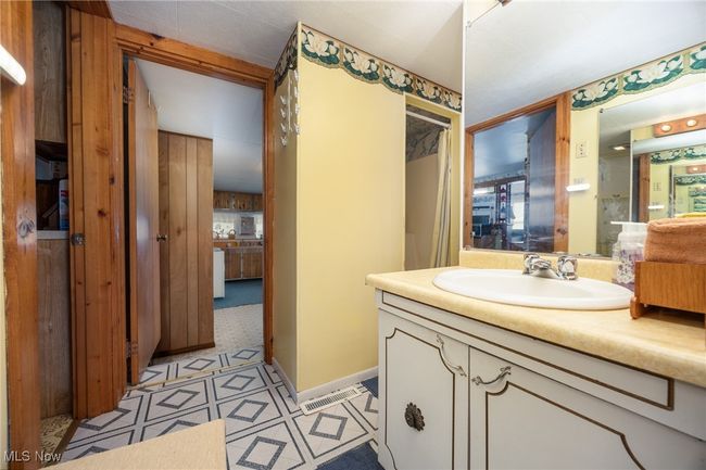 Bathroom with visible vents, ensuite bath, and vanity | Image 21