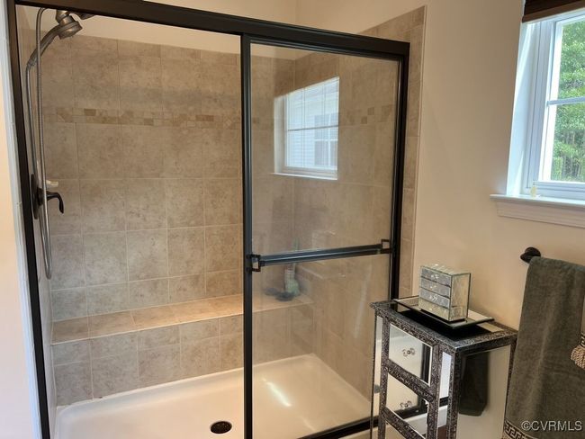 Bathroom with an enclosed shower | Image 33