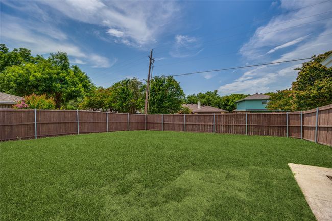 View of fenced backyard | Image 33