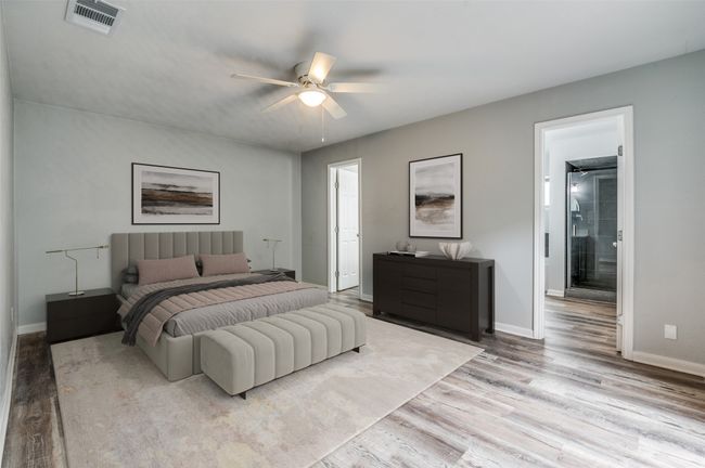 Bedroom with a ceiling fan, visible vents, wood finished floors, and baseboards | Image 7
