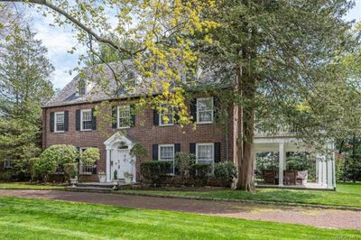 Colonial inspired home featuring a front yard | Image 2