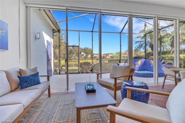 Sunroom with an outdoor hangout area and a hot tub | Image 23