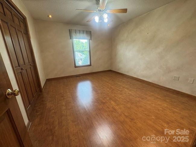 Secondary front bedroom with double door closet | Image 23