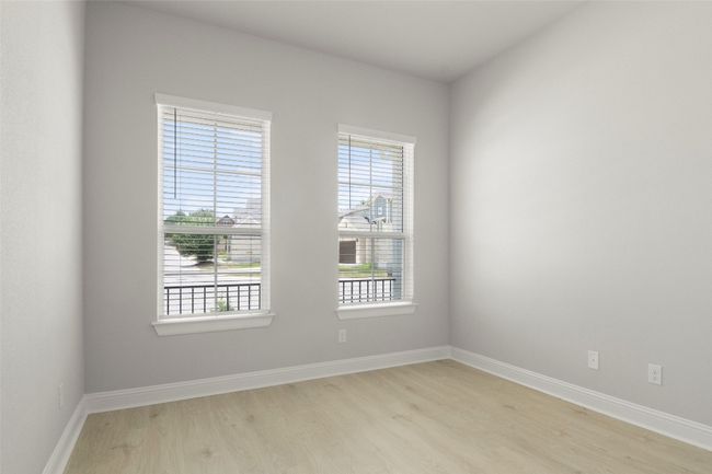 Unfurnished room featuring light wood-style floors and plenty of natural light | Image 30