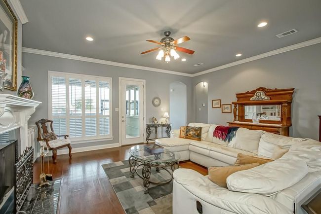 Back door leads to enclosed screened patio. Plantation shutters. | Image 11