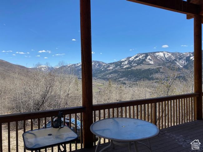 Deck featuring a mountain view | Image 13