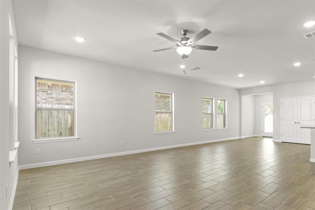 Unfurnished room with visible vents, ceiling fan, recessed lighting, and wood finished floors | Image 6