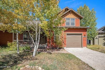 Craftsman inspired home featuring a porch and a garage | Image 3