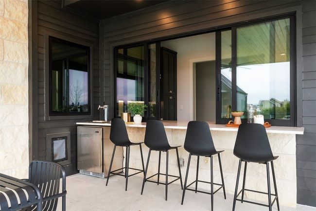 With the bar top linking directly to the pantry, you can effortlessly move from prep to pour, creating the perfect setup for outdoor gatherings, casual meals, or spontaneous cocktail hours | Image 30