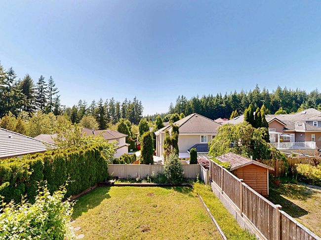 Fenced backyard with a residential view | Image 38