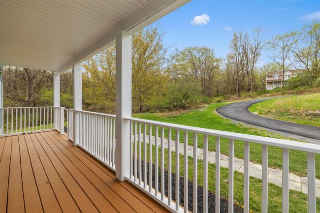 Wooden terrace featuring a porch | Image 36